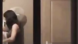 He admires himself in the mirror, completely naked