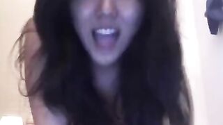 Asian beauty masturbates solo on the bed, showcasing her sensual side