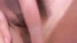 A young Russian model with a beautiful breast plays with a toy on the webcam