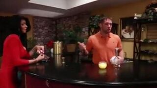Sexy brunette with fake boobs seduced the bartender to fuck on the couch