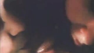 A vintage blowjob scene featuring a woman with a passion for cum
