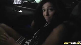 Brunette woman gets cum on her face after having sex on the bed