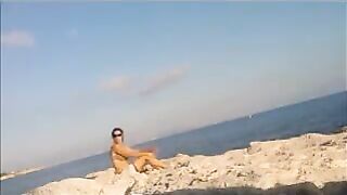 The girl got a tan from sunbathing naked on the beach
