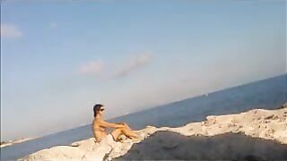 The girl got a tan from sunbathing naked on the beach