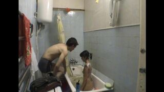 A girl is having fun with her brother in the bathroom, a daring act
