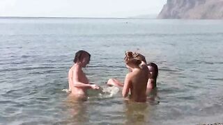 Nude beauties have fun on the beach