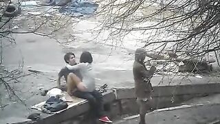 The guy shoots sex with a girl straight on the street