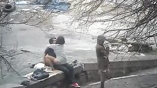 The guy shoots sex with a girl straight on the street