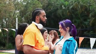 A young guy is having fun with a girl in the yard