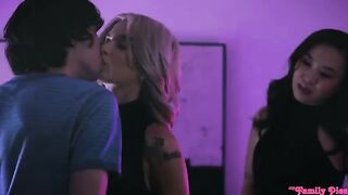 An Asian girl and a blonde are having fun with a guy