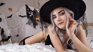A cute witch in costume is waiting for the magic of intimacy