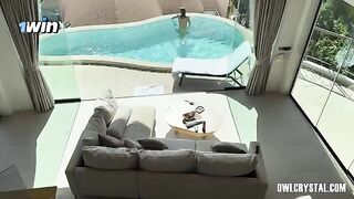 A pretty girl has a vacation in the swimming pool