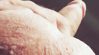 The hand slides along the entire length, up and down, moaning loudly