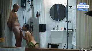 A couple enjoys intimacy in the shower stall, exploring every inch