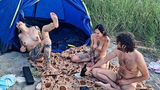 Two girls have sex in the woods after playing a bottle game