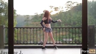 The girl with the wet pussy squirts on the balcony from a machine, showcasing her creative side